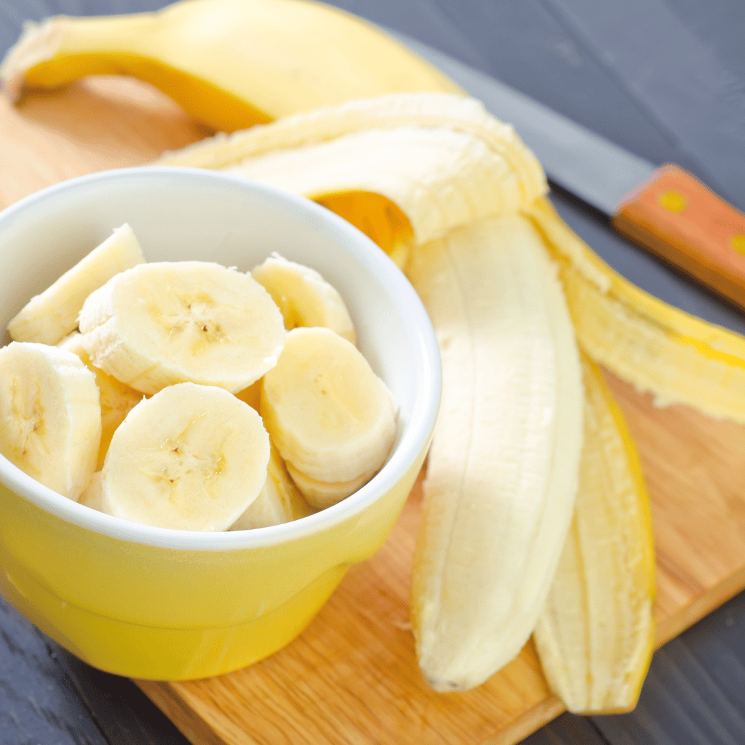 Bananas sliced in a yellow bowl