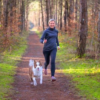 Woman running with her dog